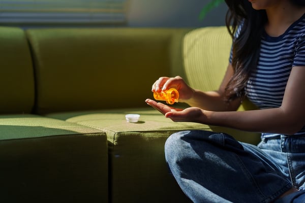 patient taking prescription medications at home