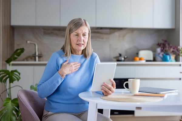 patient using pharmacy technology to speak with a pharmacist about medication symptoms