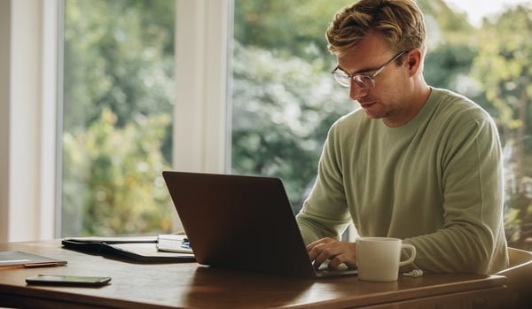 remote pharmacist using pharmacy solution on a laptop