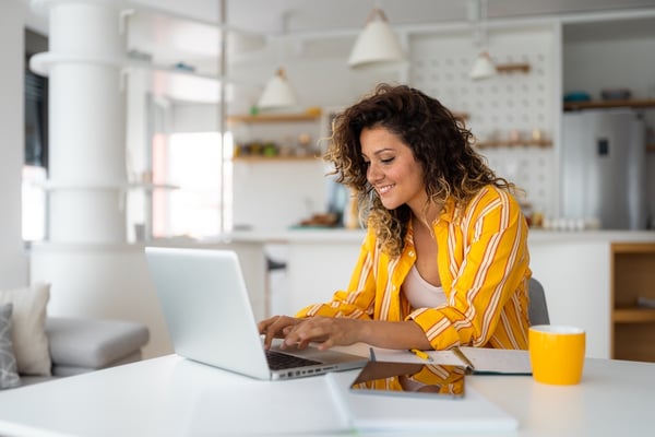 remote pharmacist working at home on a laptop helping vulnerable populations achieve healthcare equity