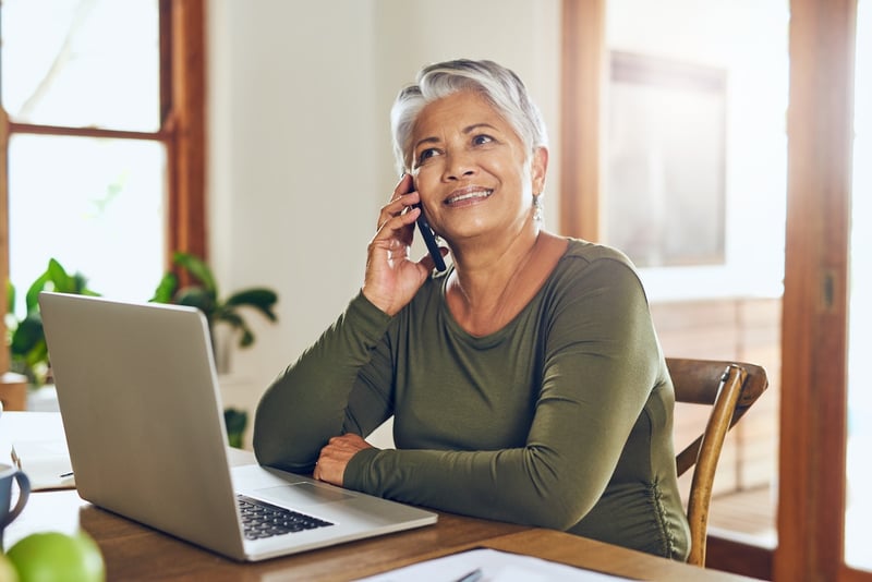 woman speaking on the phone with a pharmacist to discuss comprehensive medication review and treatment